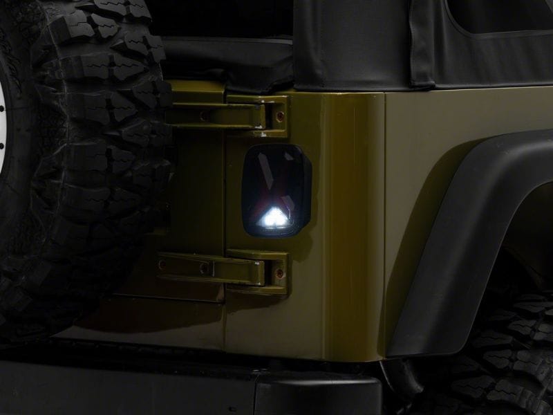 Raxiom 76-06 Jeep CJ7 Wrangler YJ & TJ Gladiator LED Tail Lights- Black Housing (Smoked Lens)