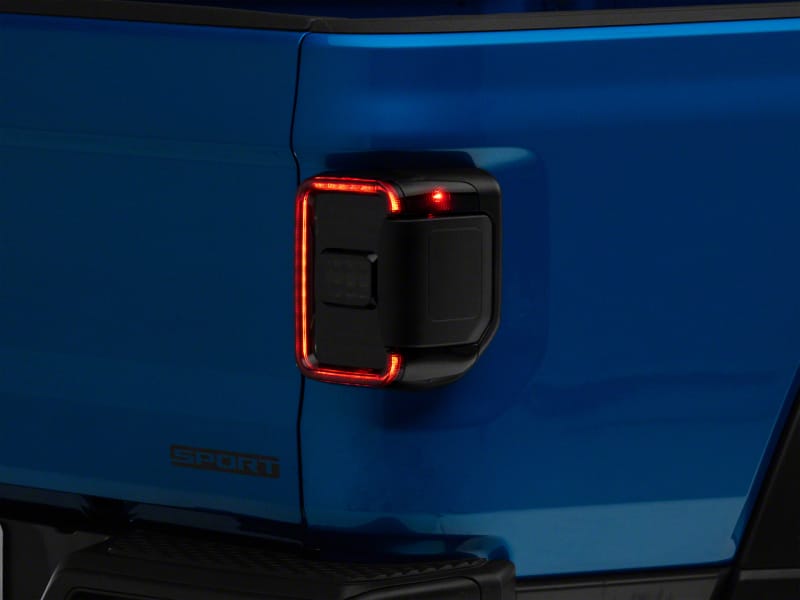 Raxiom 20-23 Jeep Gladiator JT w/ Factory Halogen LED Tail Lights- Black Housing (Smoked Lens)
