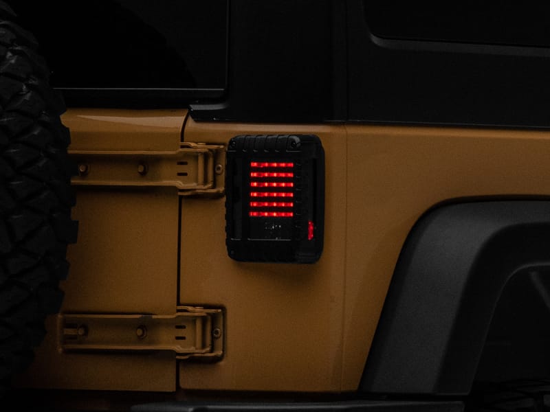Raxiom 07-18 Jeep Wrangler JK LED Tail Lights- Black Housing (Smoked Lens) - J115435